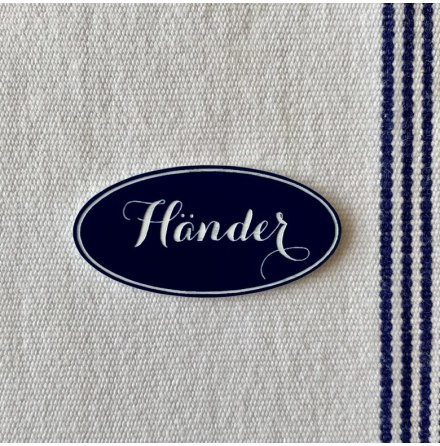 Liten skylt i handduken med text &quot;Hnder&quot;